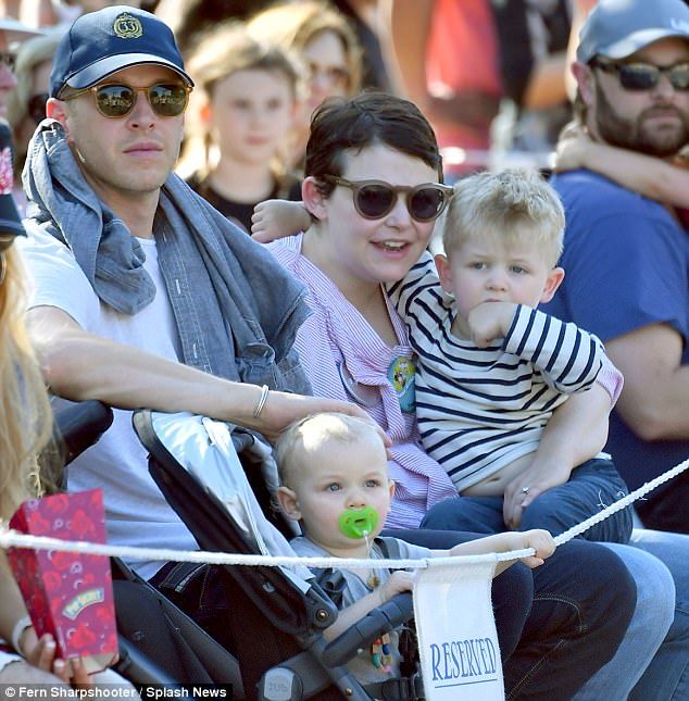 A photo of Josh Dallas with his wife and children.